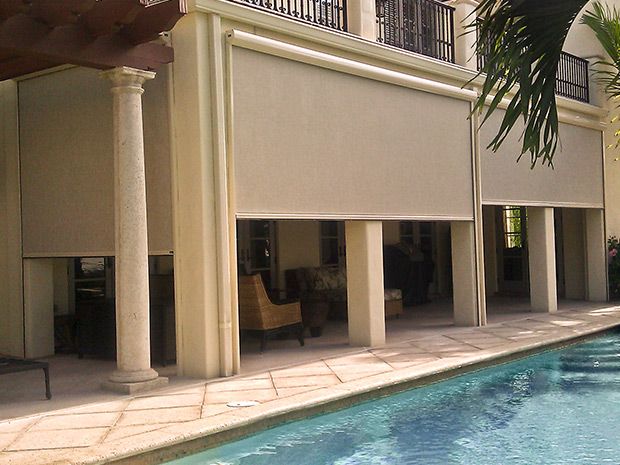 A screened gazebo enclosure on a coastal home