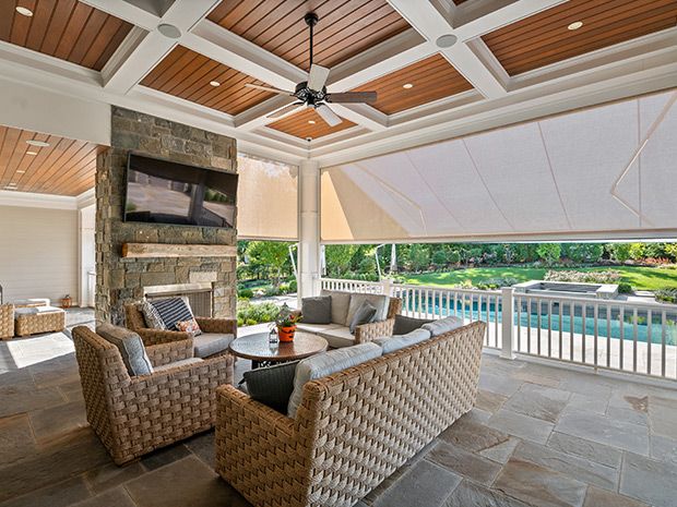 A retractable screen on a pool-cage patio