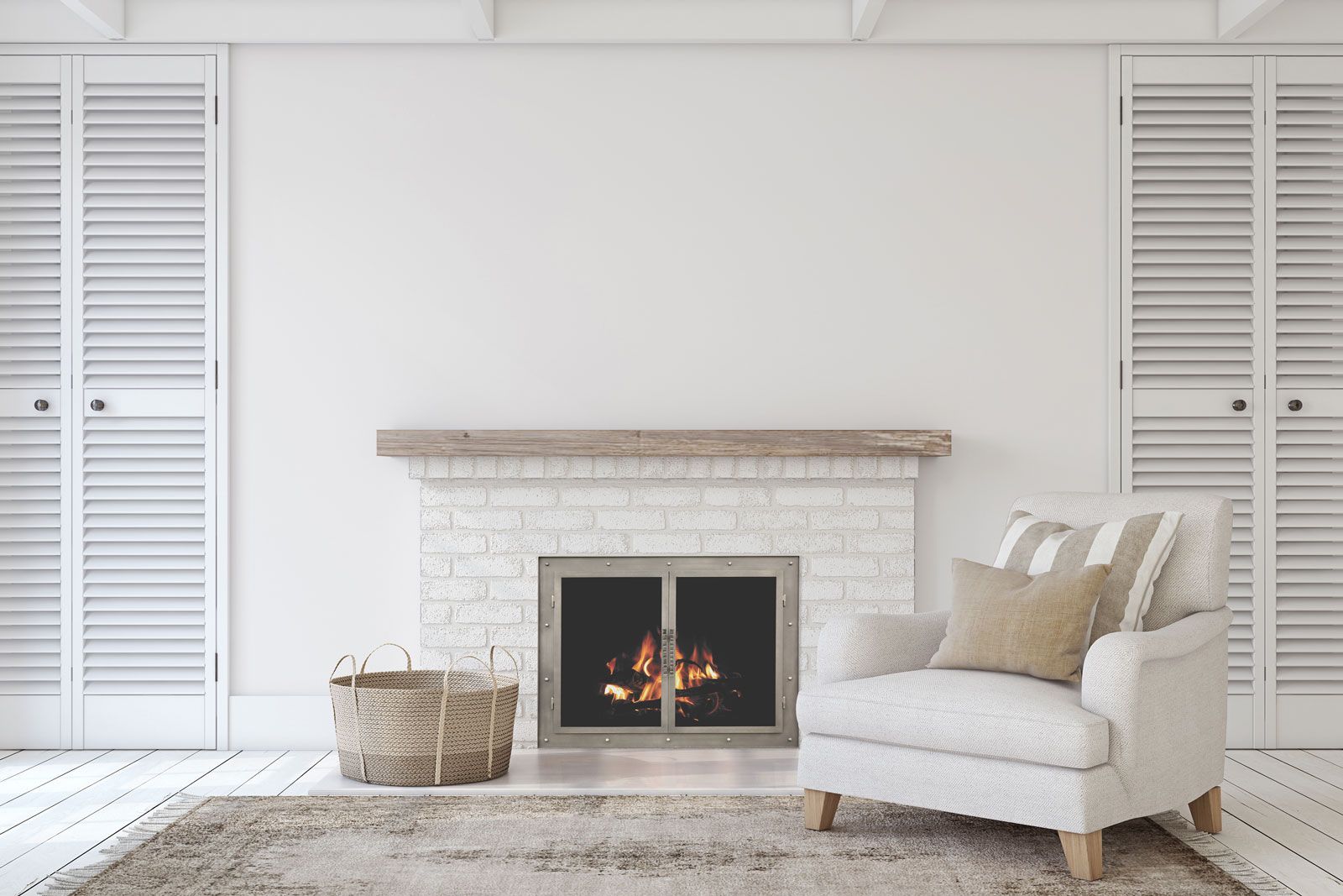 White-painted brick fireplace with black Stoll glass doors in a bright living room