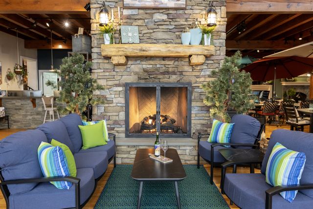 Sofas by a live-burning stone fireplace