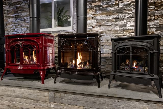 Enamel and cast-iron stoves, all burning
